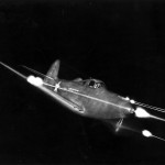 Bell P-39 Airacobra in flight firing all weapons at night. (U.S. Air Force photo)