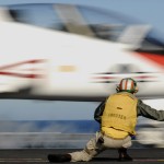 A shooter launches a T-45 Goshawk training aircraft assigned to Carrier Training Wing (CTW) from the aircraft carrier USS Abraham Lincoln in 2008 (US Navy photo)