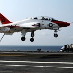 Landing signal officers watch a T-45A Goshawk training aircraft assigned to Training Squadron (VT) 7 land aboard the aircraft carrier USS George H.W. Bush in 2010 (US Navy photo)