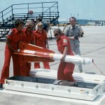 A U.S. Air Force all female weapons load team assigned to the 119th Fighter Wing "The Happy Hooligans", North Dakota Air National Guard, handle an inert AIM-4C Falcon air-to-air missile during the "William Tell" weapons competition at Tyndall Air Force Base, Florida (USA), in October 1972. (US Air Force photo)
