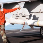 Aviation Ordnanceman 3rd Class Quentin Bryant, from Augusta, GA, gives a “thumbs up” following the inspection of an AGM-88 “HARM” air-to-ground high speed missile, loaded on an F/A-18C “Hornet.”