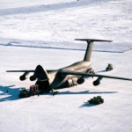 Air Force Cargo is unloaded from a C-5B Galaxy aircraft following its landing on the ice runway near McMurdo Station during Operation DEEP FREEZE '90. The Galaxy is the second such aircraft to land on the runway, which is over 10,000 feet long and was scraped from ice over eight feet deep.