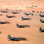 F-15E Eagle fighter aircraft of the 4th Tactical Fighter Wing, Seymour Johnson Air Force Base, N.C., are parked on an air field during Operation Desert Shield.