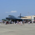 Crowds at the air show used the massive B-1 wings as shade as temperatures rose into the 90s with high humidity. (Air Cache photo/John M. Guilfoil)