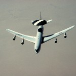 An E-3 Sentry aircraft flies over the desert during Operation Desert Shield.